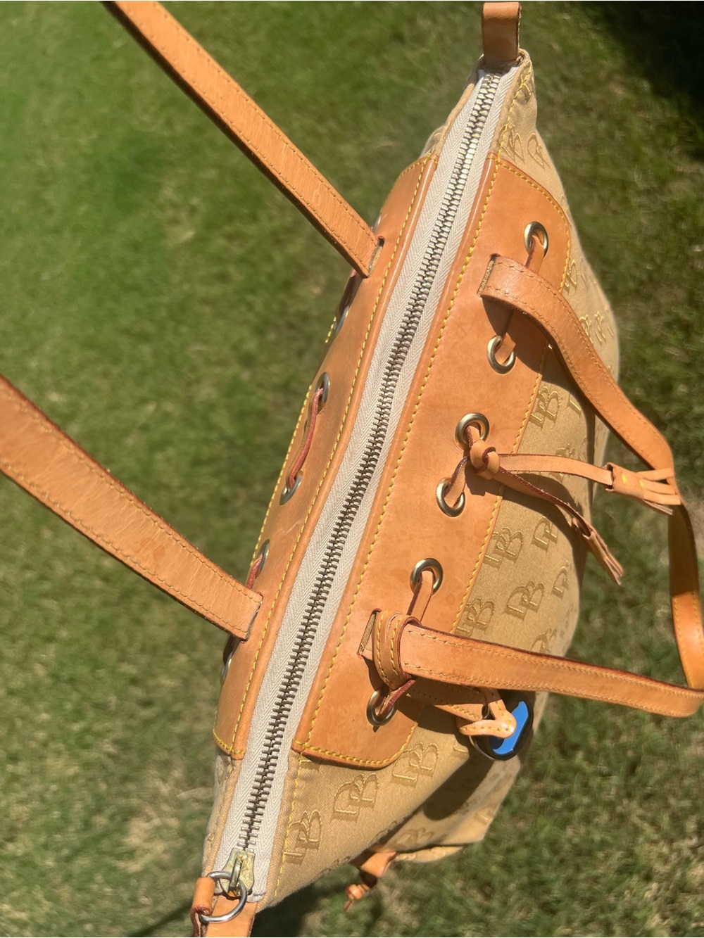 Dooney & Bourke DB Tassel Zip Top Tote Sand Tan Canvas Saddle
Tan Leather - Picture 11 of 14